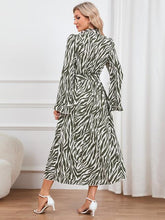 Load image into Gallery viewer, Animal Print Tie Front Ruffle Trim Dress
