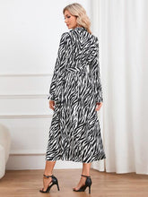 Load image into Gallery viewer, Animal Print Tie Front Ruffle Trim Dress
