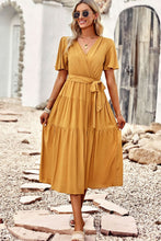 Load image into Gallery viewer, Belted Flutter Sleeve Tiered Surplice Dress
