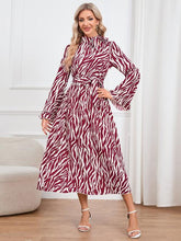 Load image into Gallery viewer, Animal Print Tie Front Ruffle Trim Dress
